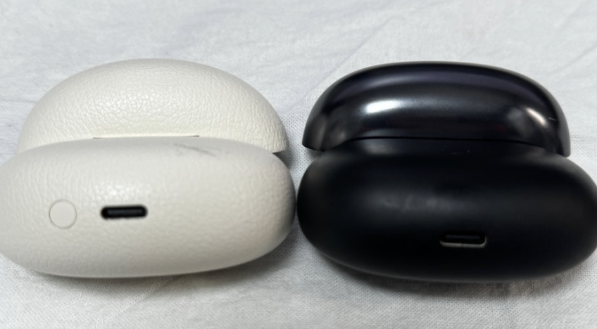 QCY C50 next to Shokz OpenFit for size comparison
